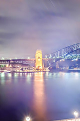 Fototapeta premium Sydney city bridge brightens with lights over the river