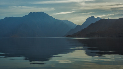 Beautiful mountains reflected in the water. Fjords on the Musandam peninsula. Khasab. Oman