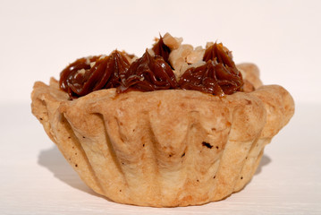 Freshly baked jam cake against white background closeup. Shallow depth of field
