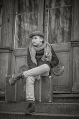 Portrait of a boy sitting on the suitcase 