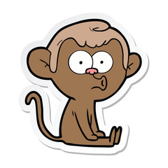 sticker of a cartoon hooting monkey