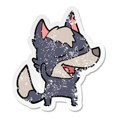 distressed sticker of a cartoon wolf laughing