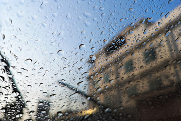 Windshield on rainy days, visible outside the building.