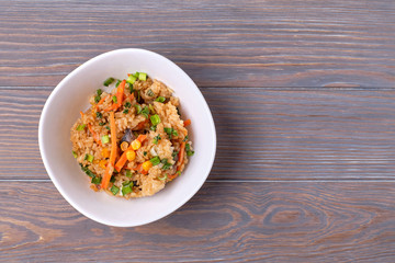 japanese food on a wooden table, fried rice with vegetables. Asian/Japanese food. Top view