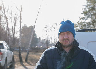 portrait of a man in a hat with steam