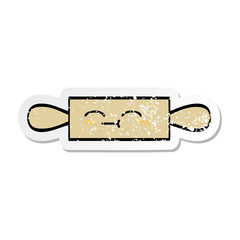 distressed sticker of a cute cartoon rolling pin