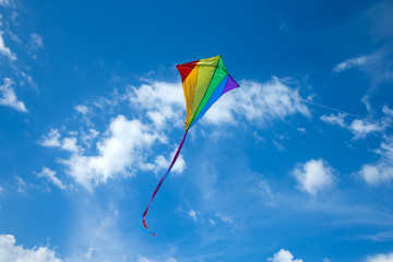 Kite flying in the sky among the clouds