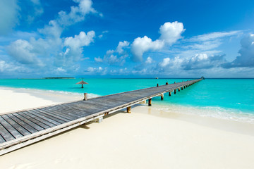  Maldives island with white sandy beach and sea