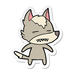 sticker of a cartoon wolf showing teeth