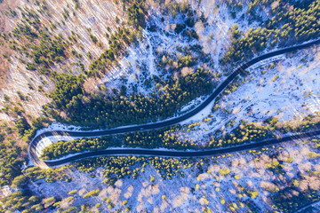 Above view of winding road in forest