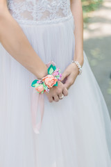 Beautiful hands of a young bride in a wedding dress.