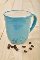 Coffee cup isolated on wooden table
