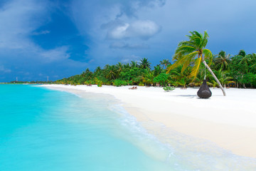  Maldives island with white sandy beach and sea