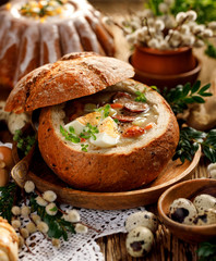 Easter soup, The sour soup (Żurek) made of rye flour with smoked sausage and eggs served in bread bowl. Traditional polish sour rye soup, popular Easter dish