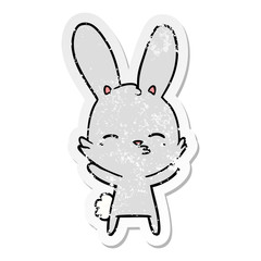distressed sticker of a curious bunny cartoon