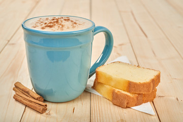 coffee with pound cake on wooden table