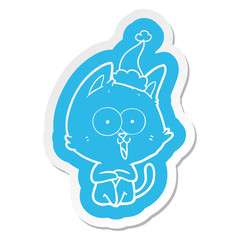 funny cartoon  sticker of a cat wearing santa hat