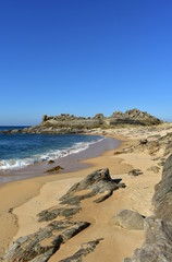 Beach and prehistoric settlement ruins. Castro de Baroña, Coruña, Spain.