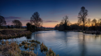 Fototapeta na wymiar Sunset on the River Test near King's Somborne, Hampshire, UK