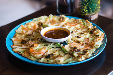 Seafood pancake with shrimp and spring onion and sauce