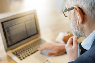 Businessman on cellphone working in modern office space