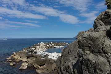 Fototapeta na wymiar Italy,Cinque Terre,Riomaggiore, a close up of a rock near the ocean