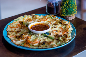 Seafood pancake with shrimp and spring onion and sauce