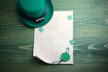 St. Patrick's Day. Leprechaun hat with empty blank and wax seal with shamrock