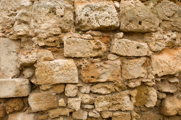 Old stone wall made of sandstone
