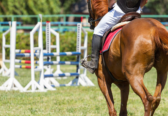 Jockey riding boot in the stirrup