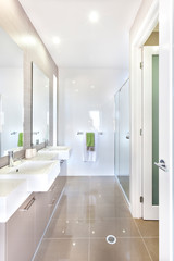 Fototapeta na wymiar Modern bathroom with set of washstands and bathroom