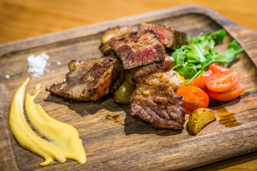 Bistecca Grain-fed Ribeye dry brined and dry aged.  Served with mustard and sea salt.