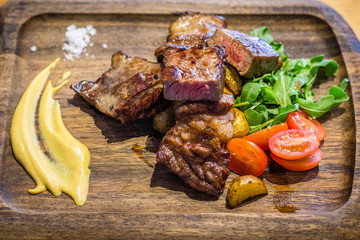 Bistecca Grain-fed Ribeye dry brined and dry aged.  Served with mustard and sea salt.