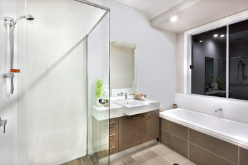 Fototapeta na wymiar New bathroom with washing area, including bath tub