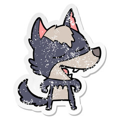 distressed sticker of a cartoon wolf laughing