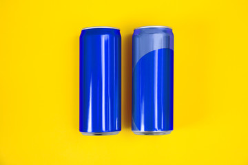 Blank metal blue cans on color background, flat lay. Mock up for design