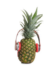 Funny pineapple with headphones on white background