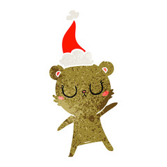 peaceful retro cartoon of a bear wearing santa hat