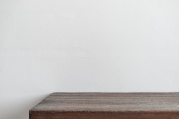 Wall of wooden table in front of background