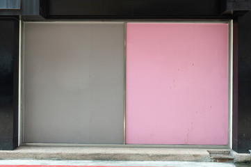 Large blank billboard on a street wall, banners with room to add your own text