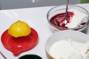Blueberry cheesecake. Ingredients for cooking are located on the surface of the table.