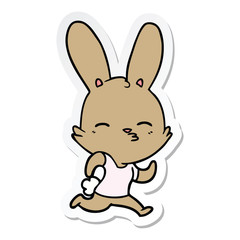 sticker of a cartoon running rabbit