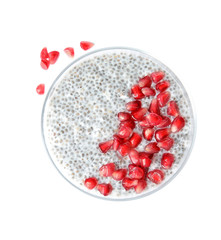 Dessert bowl of tasty chia seed pudding with pomegranate on white background, top view