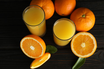 Composition with orange juice and fresh fruit on wooden background, above view