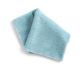 Folded soft terry towel on white background, top view