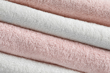 Stack of fresh soft towels as background