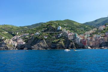 The cityscape of Riomaggiore viewed from the sea, Cinque Terre, Italy, Riviera