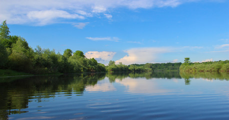 Fototapeta na wymiar beautiful background with river landscape and blue sky