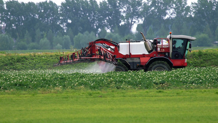 Agricultural Tractor sprayer ride in a field