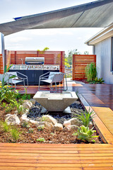 House patio area with a wooden floor and gas cabinet